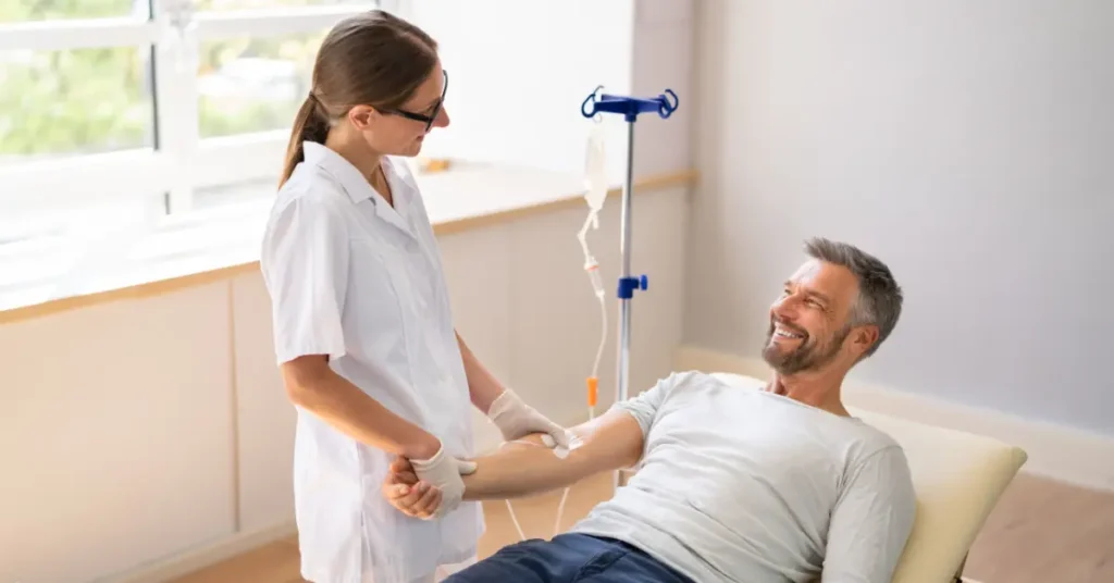 Infusion therapy for depression session with smiling man assisted by nurse during IV treatment.