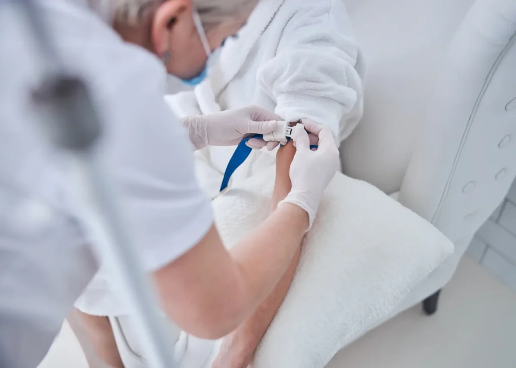 Holistic treatment for anxiety and depression shown with a healthcare worker preparing an IV line for a patient.